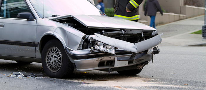 front bumper of small car smashed after car accident