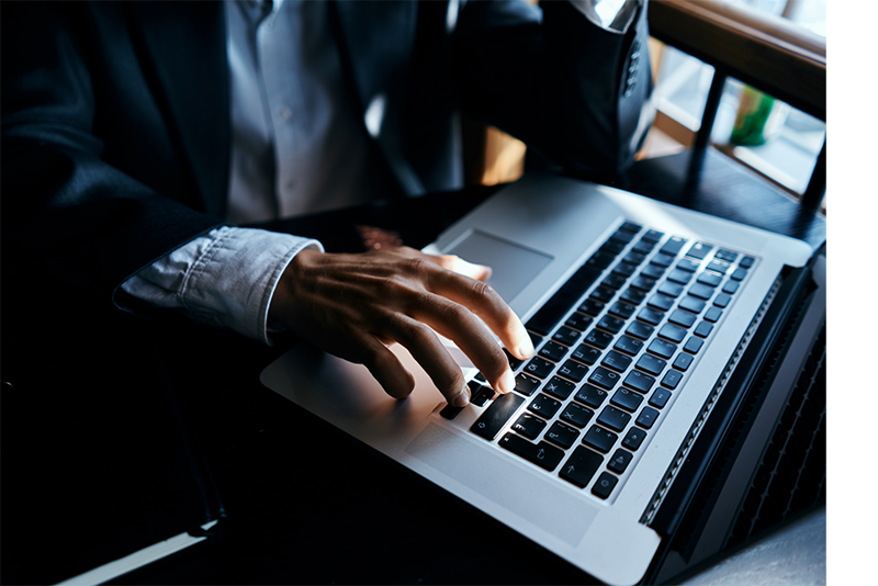 lawyer typing on laptop preparing for consulation