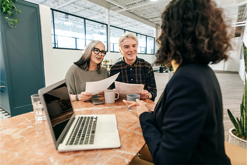 couple estate planning at a table with lawyer