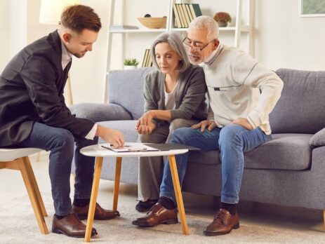 Elderly couple reviewing their will with estate planning lawyer | Fischetti Law Group